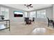 Comfortable living area with a ceiling fan and natural light streaming through large windows at 38572 N Jessica Ln, San Tan Valley, AZ 85140