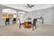 An open concept living room featuring neutral tones, dining area, and seamless flow to the kitchen at 38572 N Jessica Ln, San Tan Valley, AZ 85140