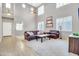 Spacious living room with high ceilings, plantation shutters, and neutral decor at 38572 N Jessica Ln, San Tan Valley, AZ 85140