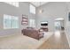 Bright and airy living room with tall windows, neutral color palette, and comfortable seating at 38572 N Jessica Ln, San Tan Valley, AZ 85140