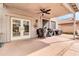 Covered patio featuring ceiling fan, lighting and an array of BBQ grills at 38572 N Jessica Ln, San Tan Valley, AZ 85140