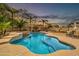 Backyard pool with palm trees, a spa, patio furniture, and a view of the sky at 38572 N Jessica Ln, San Tan Valley, AZ 85140