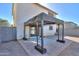 Cozy backyard with a patio area and shade structure at 40564 W Nicole Ct, Maricopa, AZ 85138