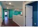 Upstairs hallway with wood-look floors and recessed lighting at 40564 W Nicole Ct, Maricopa, AZ 85138