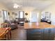 Open-concept living area with wood-look floors, flowing into the kitchen with a central island at 422 S 76Th Way, Mesa, AZ 85208