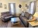 Inviting living room featuring warm neutral tones, wood-look floors, and a cozy ambiance at 422 S 76Th Way, Mesa, AZ 85208