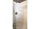 Modern shower stall with white walls and mosaic tile accents, offering a clean and functional space at 422 S 76Th Way, Mesa, AZ 85208