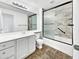 Updated bathroom featuring white vanity, sink, and tiled walk-in shower at 4233 E Covina St, Mesa, AZ 85205