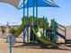 Neighborhood playground equipment featuring multiple slides, stairs, and a shade structure at 4249 W Hannah St, San Tan Valley, AZ 85144