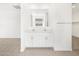 Bathroom with dual sinks, tile flooring, and a large mirror, creating a spa-like retreat at 4265 W Hannah St, San Tan Valley, AZ 85144