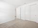 Bedroom includes carpet flooring, white walls, closet, and access to another room at 4265 W Hannah St, San Tan Valley, AZ 85144