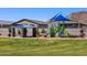 Bright playground in a community park features a picnic pavilion, modern play structure, and mountain views at 4265 W Hannah St, San Tan Valley, AZ 85144