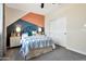 Neutral bedroom with colorful decor, plush carpet, white trim, and a closet with sliding doors at 44327 N 43Rd Dr, Phoenix, AZ 85087