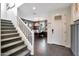 Bright foyer with staircase, tiled floor, and view of the home office at 44327 N 43Rd Dr, Phoenix, AZ 85087