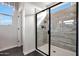 Walk-in shower featuring sleek glass enclosure, modern tiling, and a relaxing spa-like atmosphere at 44327 N 43Rd Dr, Phoenix, AZ 85087