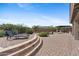 A beautiful backyard features a pool, outdoor kitchen, and multiple seating areas at 4651 N 204Th Ave, Buckeye, AZ 85396