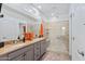 Modern bathroom with double sinks, granite countertops, and a spacious glass shower at 4651 N 204Th Ave, Buckeye, AZ 85396