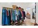 Walk-in closet with ample storage, shelving, and well-organized hanging space at 4651 N 204Th Ave, Buckeye, AZ 85396