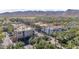 Aerial view of a charming commercial district with palm trees and mountain views at 4651 N 204Th Ave, Buckeye, AZ 85396