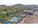 An aerial view of the community pool featuring lap lanes, lounge areas, and resort-style amenities at 4651 N 204Th Ave, Buckeye, AZ 85396