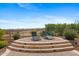 Relax in the sun on this paver patio with beautiful stone planters at 4651 N 204Th Ave, Buckeye, AZ 85396