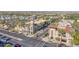 Aerial view of a shopping center with diverse storefronts, lush landscaping, and ample parking at 4651 N 204Th Ave, Buckeye, AZ 85396