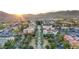 Aerial view of town center with well-manicured landscaping and commercial buildings at sunset at 4651 N 204Th Ave, Buckeye, AZ 85396