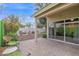 Relaxing covered back patio with beautiful brick pavers, and a backyard seating area at 473 S Ash St, Gilbert, AZ 85233