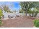 A spacious backyard featuring an outdoor fire pit, and mature landscaping at 473 S Ash St, Gilbert, AZ 85233