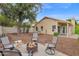 Spacious backyard with a cozy firepit area and mature tree providing plenty of shade at 473 S Ash St, Gilbert, AZ 85233