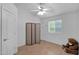 Bright bedroom with laminate wood floor featuring an accent screen at 473 S Ash St, Gilbert, AZ 85233