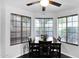 Bright dining area featuring a modern table set and large windows with wooded blinds at 473 S Ash St, Gilbert, AZ 85233