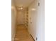 Clean, well-lit hallway featuring bamboo floors, neutral walls, and built-in shelving at 4750 N Central Ave # D4, Phoenix, AZ 85012