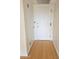 A hallway featuring a light fixture, bamboo flooring and several doors to other rooms at 4750 N Central Ave # D4, Phoenix, AZ 85012