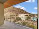 Stunning balcony showcasing a view of the community pool, mountains, and lush landscape at 5000 N Camelback Ridge Dr # 409, Scottsdale, AZ 85251