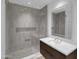 Bathroom featuring a glass enclosed shower, grey subway tile, and modern vanity at 5000 N Camelback Ridge Dr # 409, Scottsdale, AZ 85251