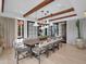 Dining room featuring a large table, modern light fixtures, and floor-to-ceiling windows at 5000 N Camelback Ridge Dr # 409, Scottsdale, AZ 85251