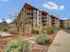 Modern apartment building featuring large windows and desert landscaping at 5000 N Camelback Ridge Dr # 409, Scottsdale, AZ 85251