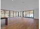 Light-filled living area with hardwood floors and floor-to-ceiling windows at 5000 N Camelback Ridge Dr # 409, Scottsdale, AZ 85251