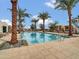 Palm trees surround the pool and lounge chairs for residents to enjoy at 5000 N Camelback Ridge Dr # 409, Scottsdale, AZ 85251