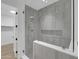 Glass walk-in shower with bench and modern grey tiling at 5000 N Camelback Ridge Dr # 409, Scottsdale, AZ 85251