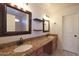 Bathroom features dual sinks, granite counters, and wooden cabinets offering lots of storage at 509 W Princeton Ave, Gilbert, AZ 85233