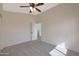 Neutral bedroom with ceiling fan and an open door at 509 W Princeton Ave, Gilbert, AZ 85233