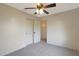 Large bedroom with closet space, an open entry, and a ceiling fan at 509 W Princeton Ave, Gilbert, AZ 85233