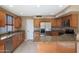 Open kitchen with granite counters, stainless appliances, and wood cabinets at 509 W Princeton Ave, Gilbert, AZ 85233