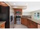 Kitchen featuring stainless appliances, wood cabinets, and granite countertops at 509 W Princeton Ave, Gilbert, AZ 85233