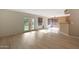 Open-concept living room featuring wood floors, French doors, and lots of natural light at 509 W Princeton Ave, Gilbert, AZ 85233