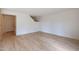 Bright living room featuring light wood-look floors and a doorway to another room at 509 W Princeton Ave, Gilbert, AZ 85233