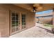 Covered patio features ceiling fan and french door access to the backyard at 509 W Princeton Ave, Gilbert, AZ 85233