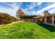 Expansive backyard with lush green lawn, patio and pool area ideal for outdoor enjoyment at 5318 W Aire Libre Ave, Glendale, AZ 85306